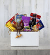 Gift basket in wooden box containing decorative football turkey and snacks.